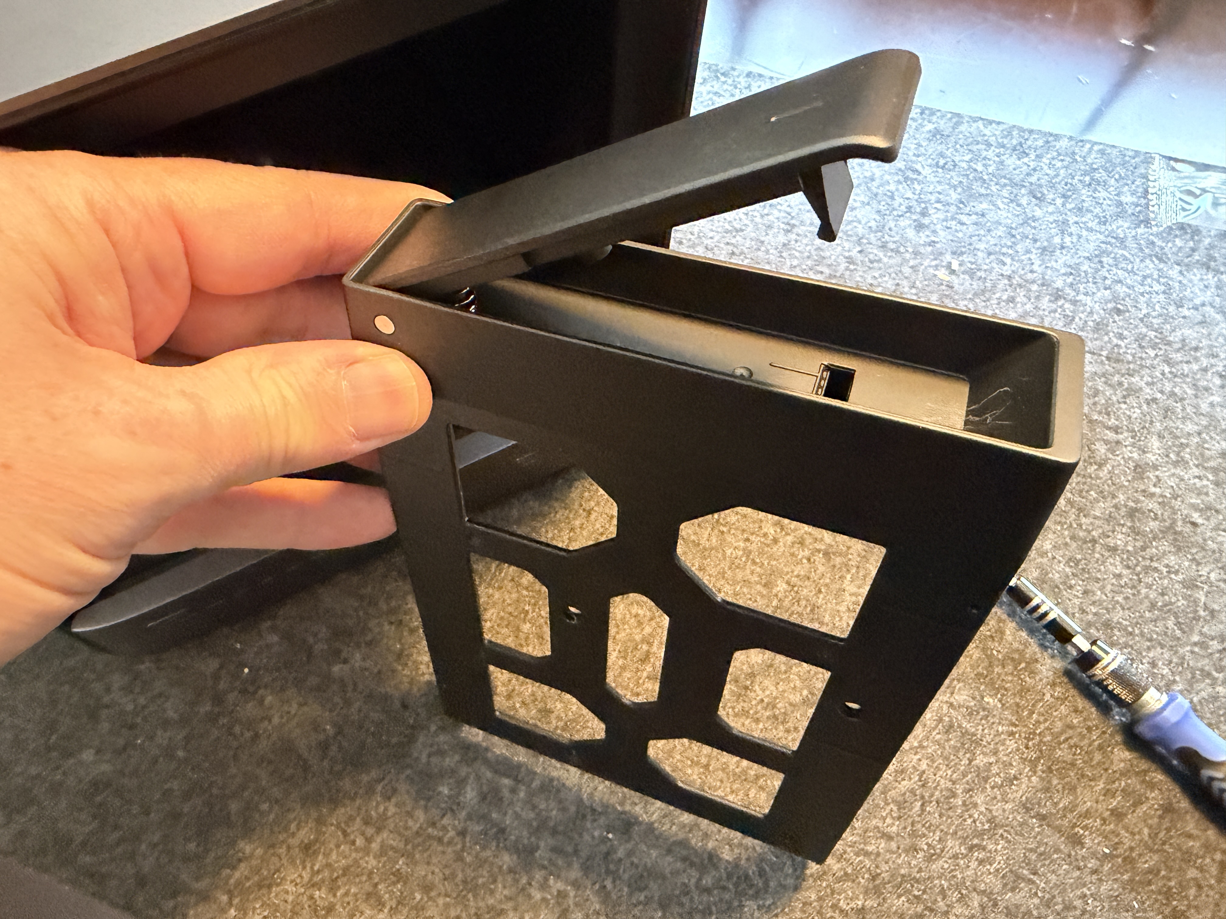 N5 Air drive tray held in hand showing interference-fit clips and rubber vibration pads