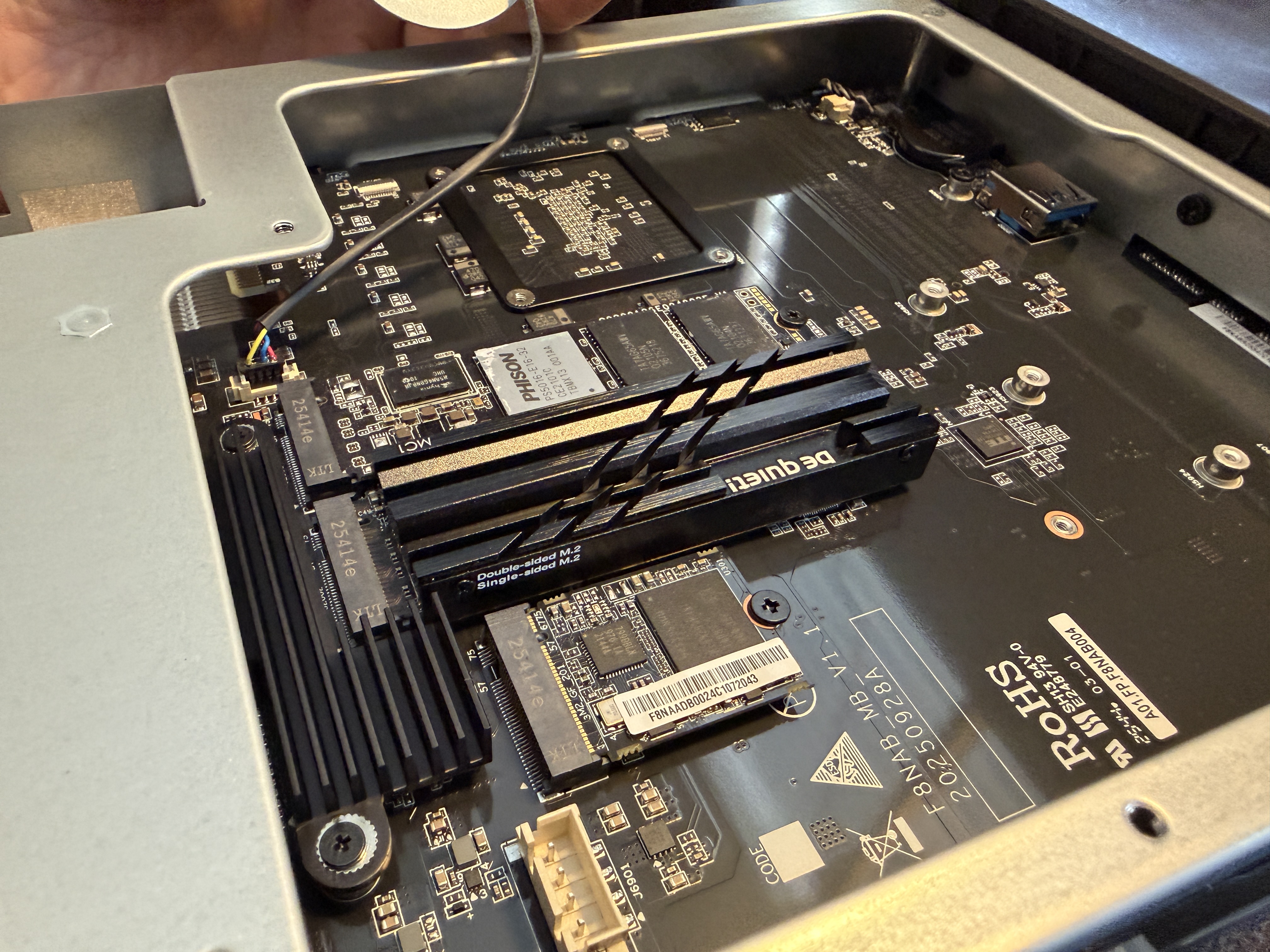 N5 Air NVMe slots with three drives installed including Be Quiet MC1 heatsink, NVMe fan lifted