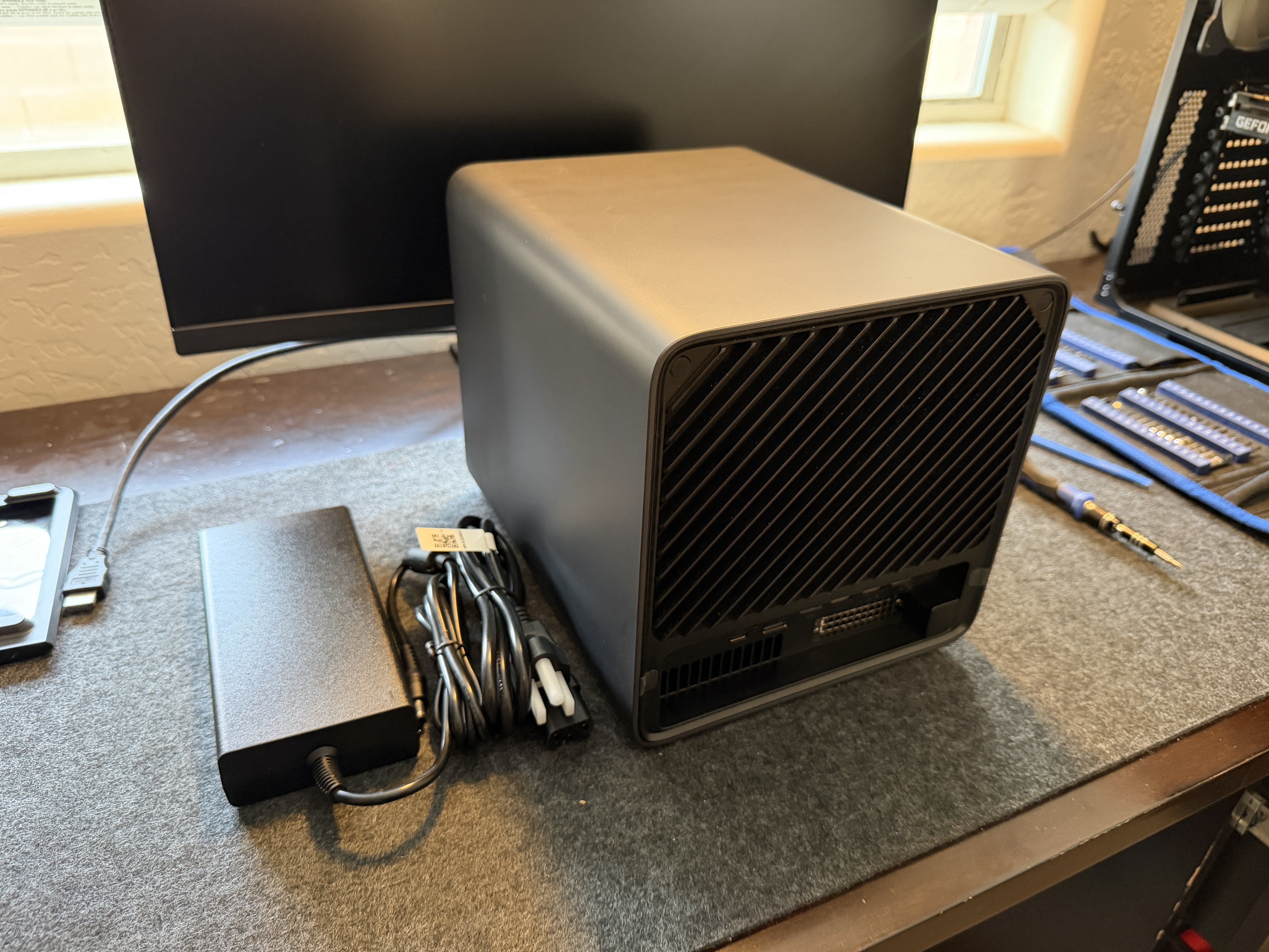 Minisforum N5 Air rear view with external DC power brick and cable visible