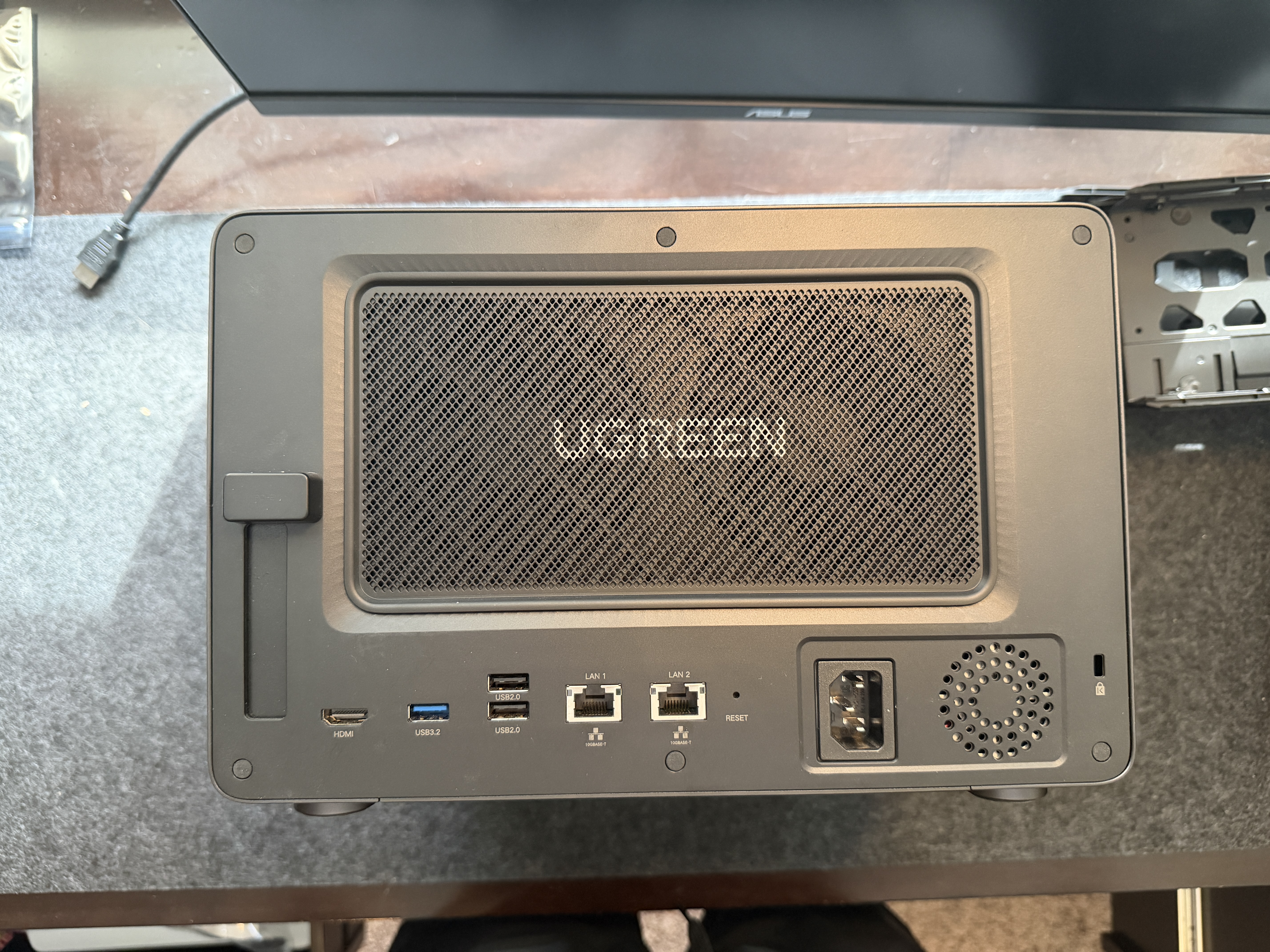 UGREEN DXP6800 Pro rear panel with magnetic dust filter, I/O ports, and built-in PSU power inlet