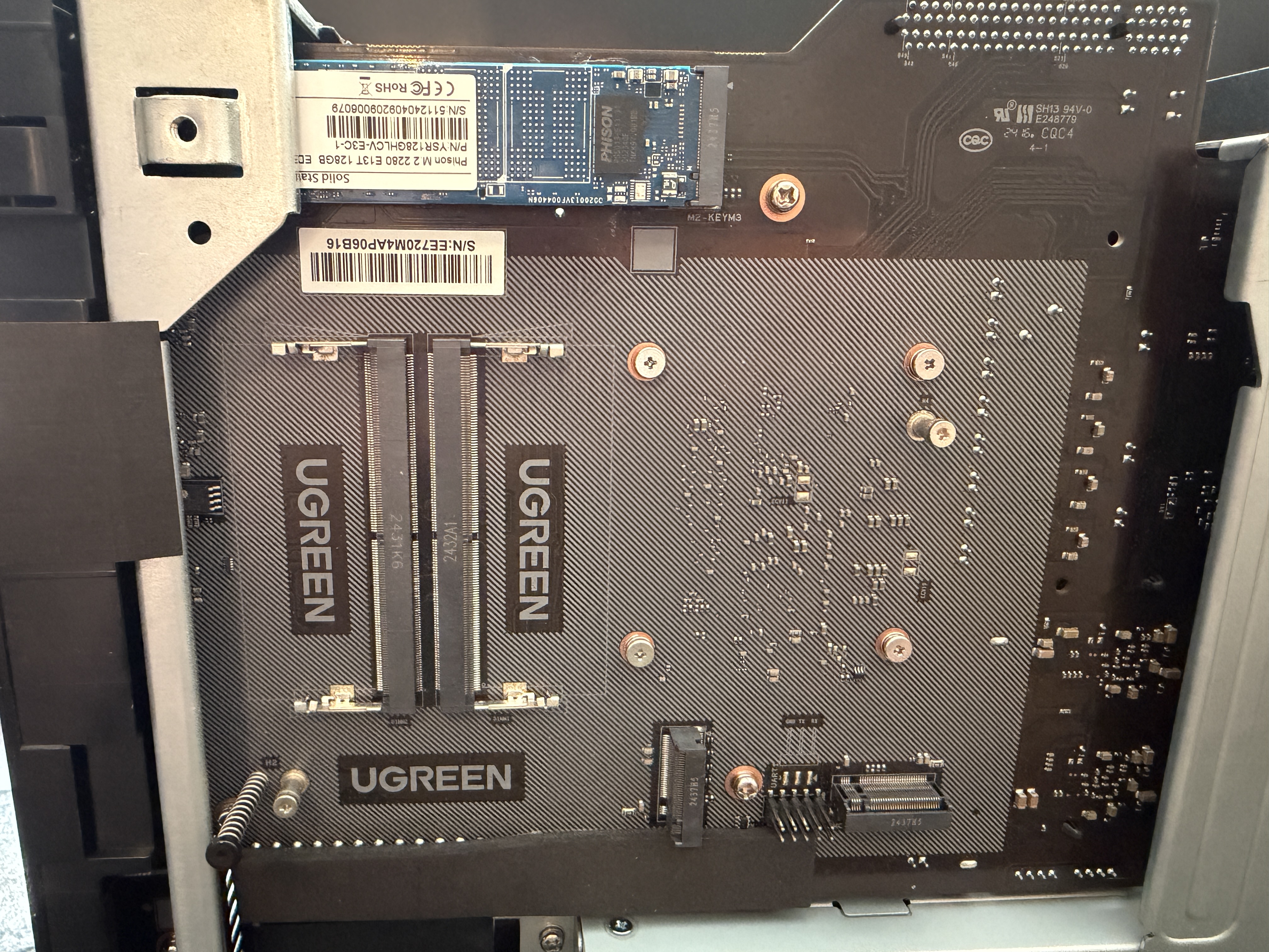 UGREEN DXP6800 Pro bottom panel showing 128GB boot NVMe, M.2 expansion slots, and DDR5 RAM area
