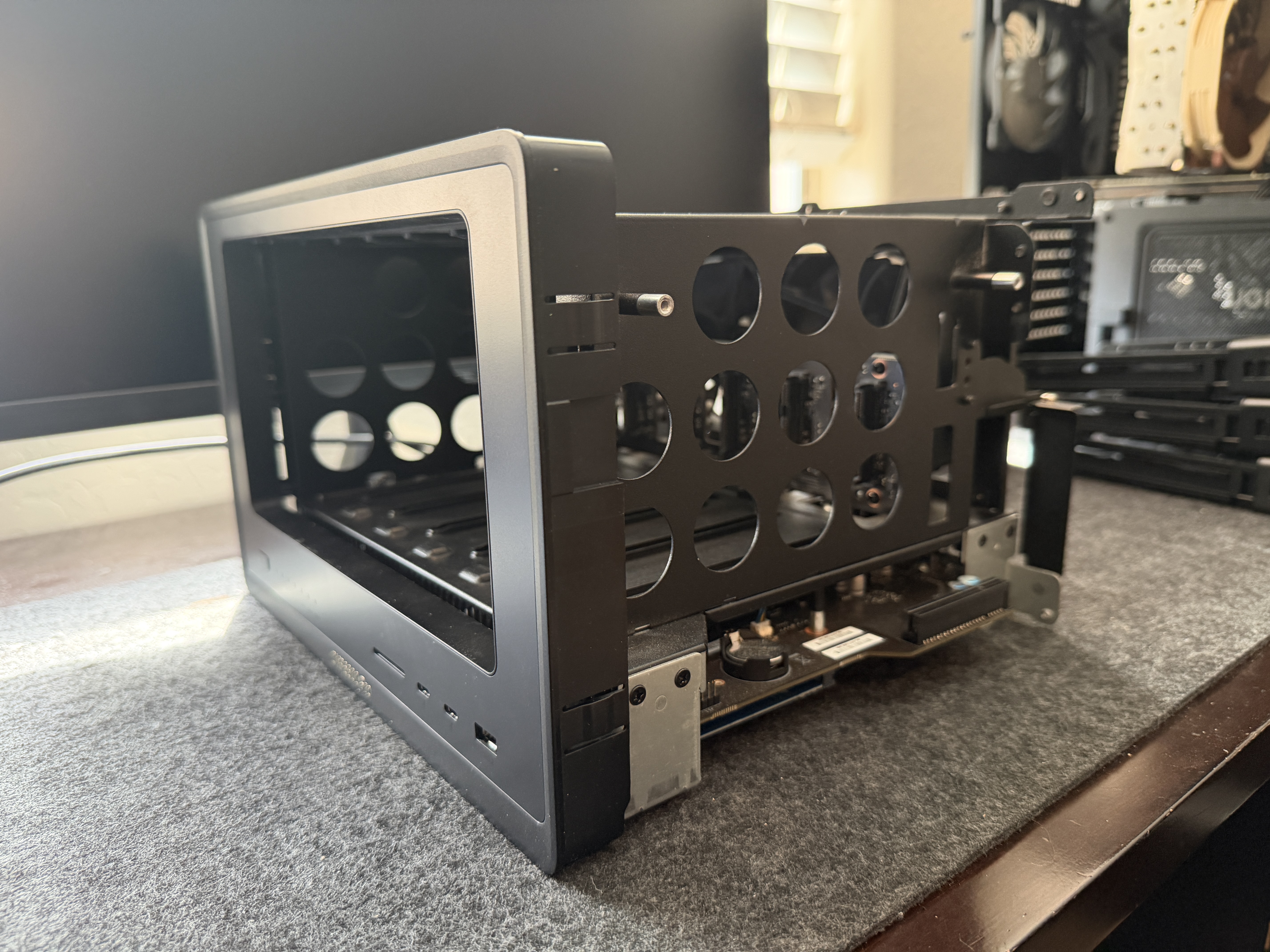 UGREEN DXP6800 Pro metal shell with circular weight-reduction holes and PCIe slot opening