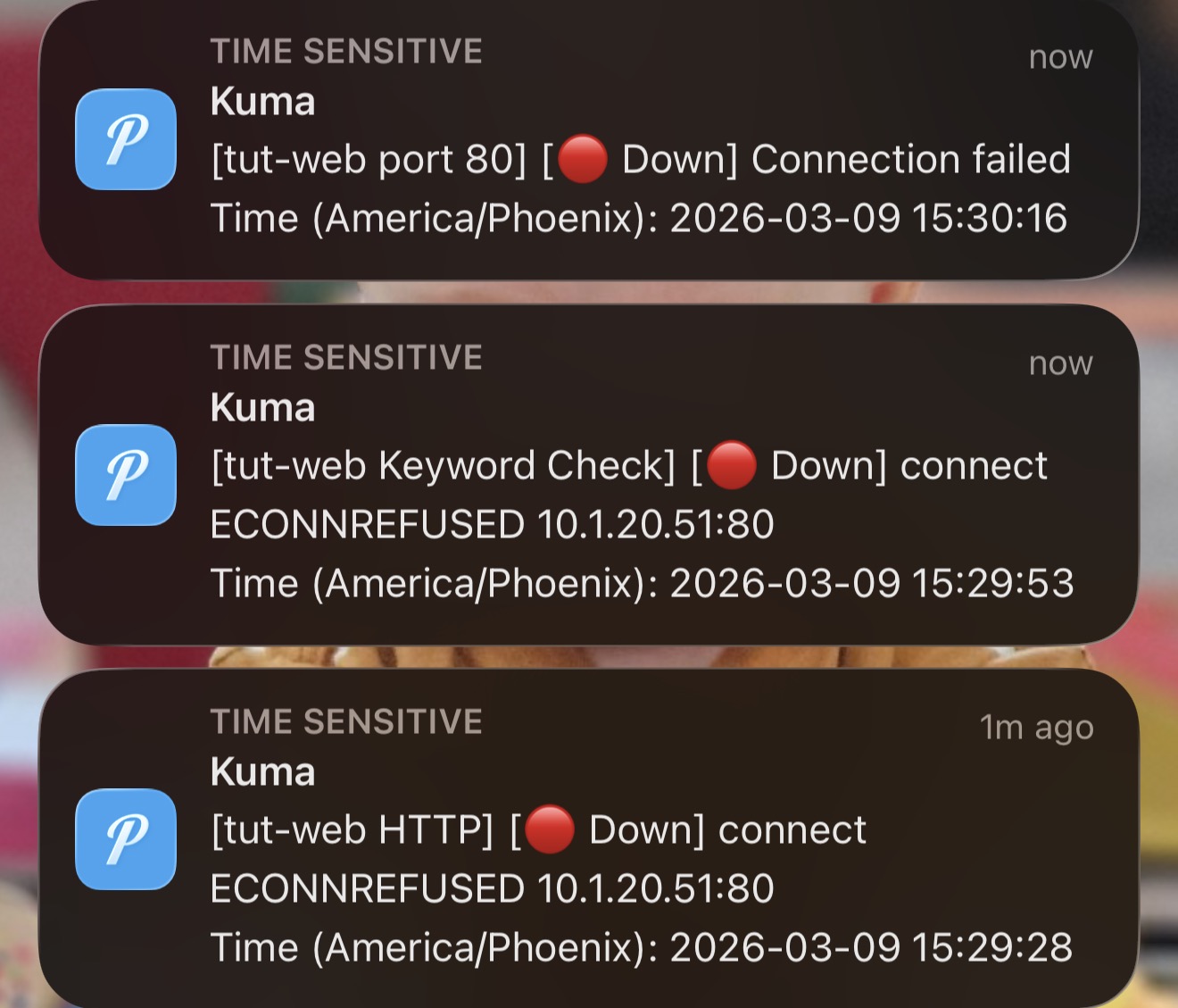 iPhone showing three stacked Pushover down notifications for tut-web port 80 Keyword Check and HTTP monitors